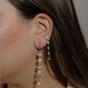 girl wearing hypoallergenic crystal and pearl drop chain statement earrings made with pure medical grade titanium ||all