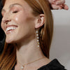 girls wearing crystal and pearl drop chain bridal statement earrings ||all