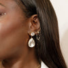 girl wearing teardrop crystal statement stud bridal earrings