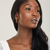 girl wearing hypoallergenic bridal statement earrings and nickel free lariat wedding necklace 