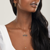 girl wearing hypoallergenic bridal lariat necklace and gold titanium wedding earrings
