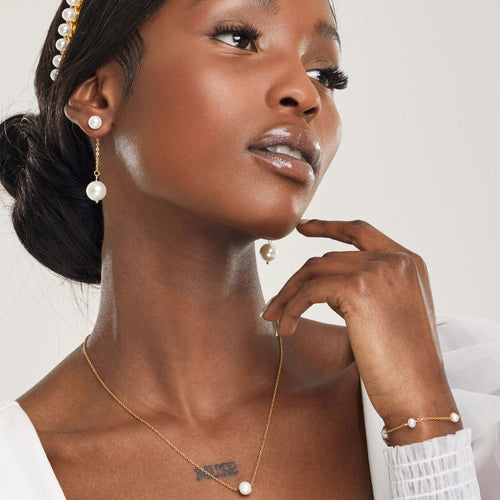 girl wearing pearl hypoallergenic bridal wedding jewelry set